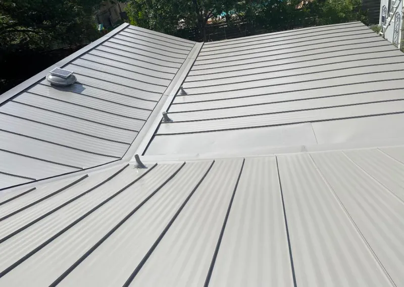 Solar attic fan installed on a metal roof for Roof Ventilation in Veneta